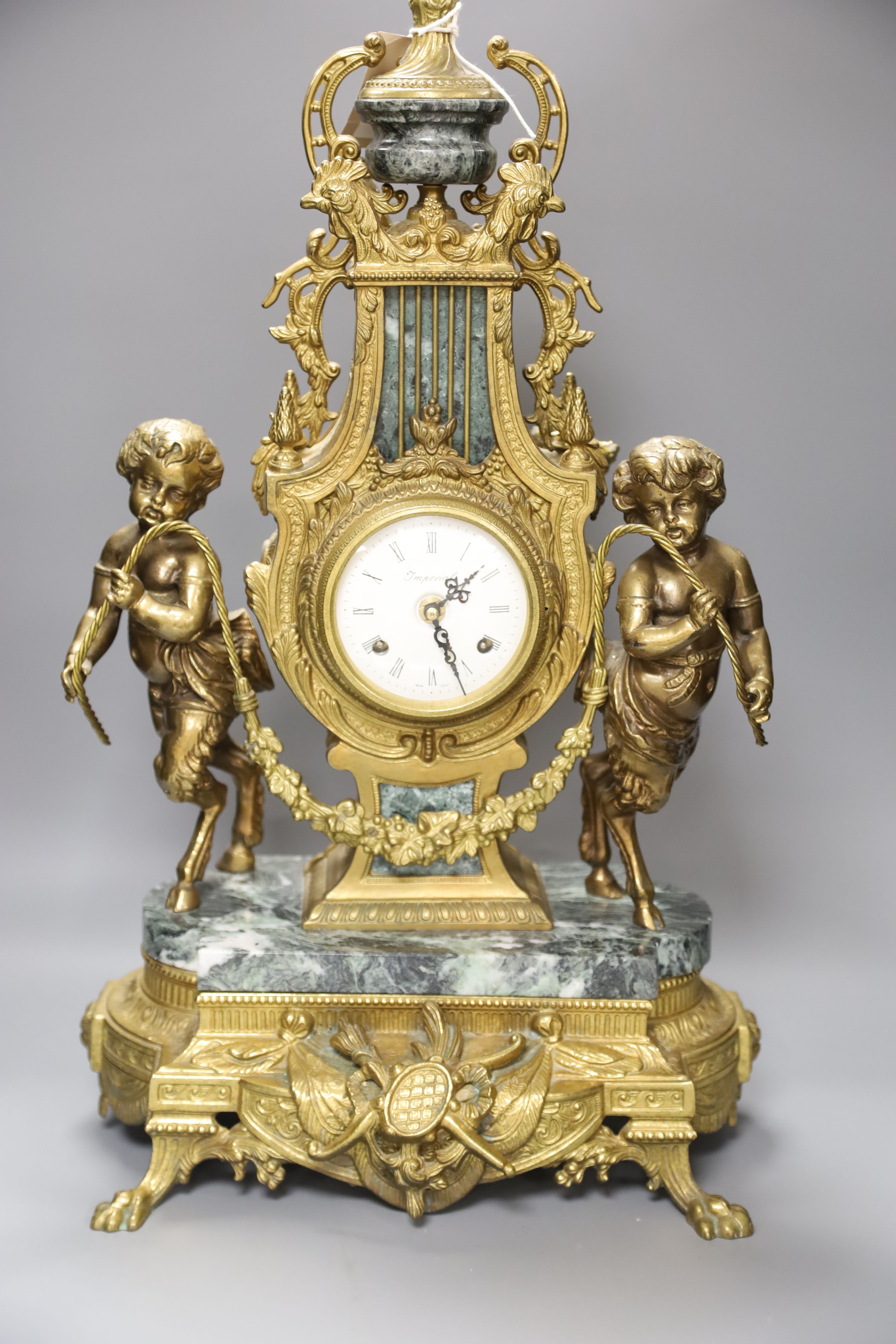 A Louis XVI style ormolu and variegated green marble mantel clock, H approx 60cm